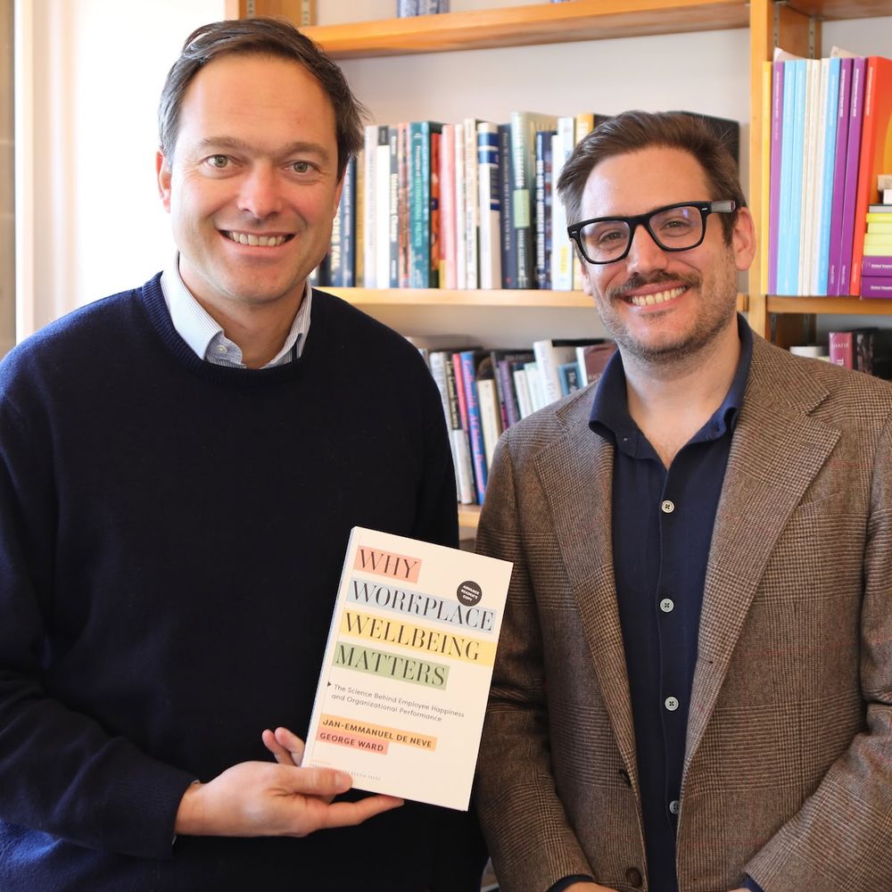 Prof De Neve and Dr George Ward pictured with their book