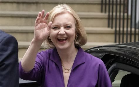 A picture of a waving Liz Truss