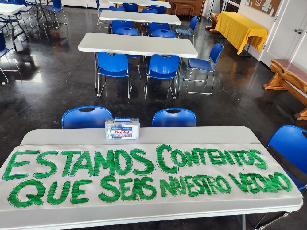 Poster reading we are happy that you are our neighbors