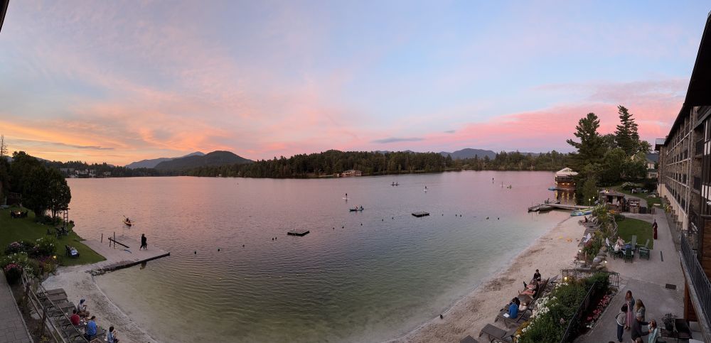 Lake upstate New York at sunset in the Adirondacks gorgeous yellows pinks oranges and gold