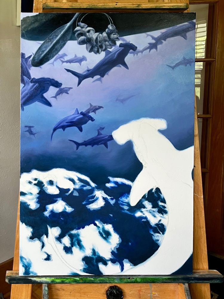 In-progress painting of a group of hammerhead sharks. 
