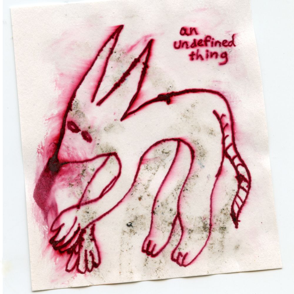 drawing of a sort of creature hunched over on all fours. human hands, long pointed ears, a rat tail. the drawing is in red ink which has blurred and smeared. there's dirt smeared underneath