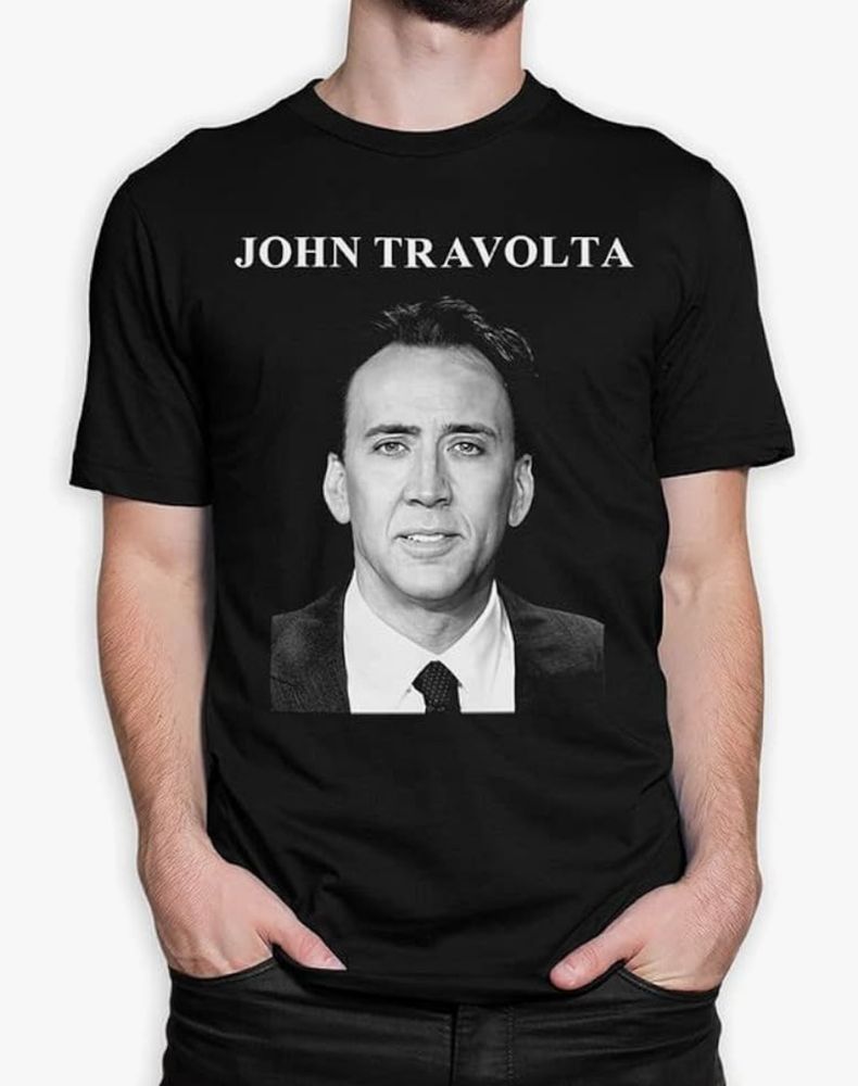 A T-shirt with Nicholas Cage's face and John Travolta printed as caption 