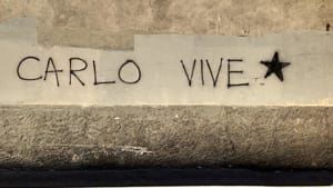 carlo lives written on a wall