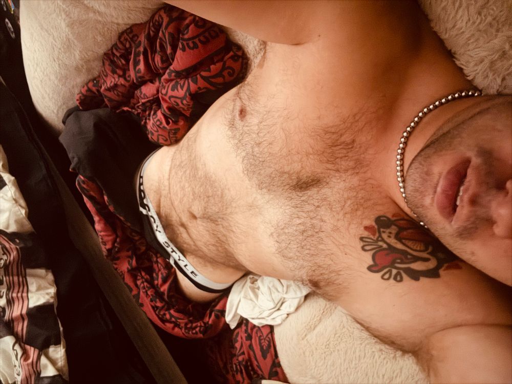 Fuzzy ass bunny boy in a dog bed 