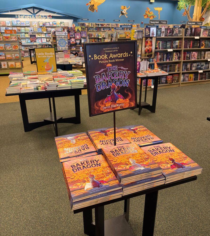 Another display, this one with a sign that reads book awards picture book winner: the bakery dragon. In the background we can see more of the bookstore