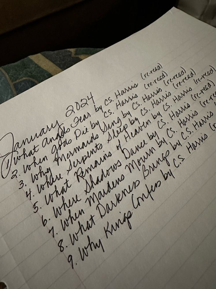 Notebook page with lines of indistinct writing