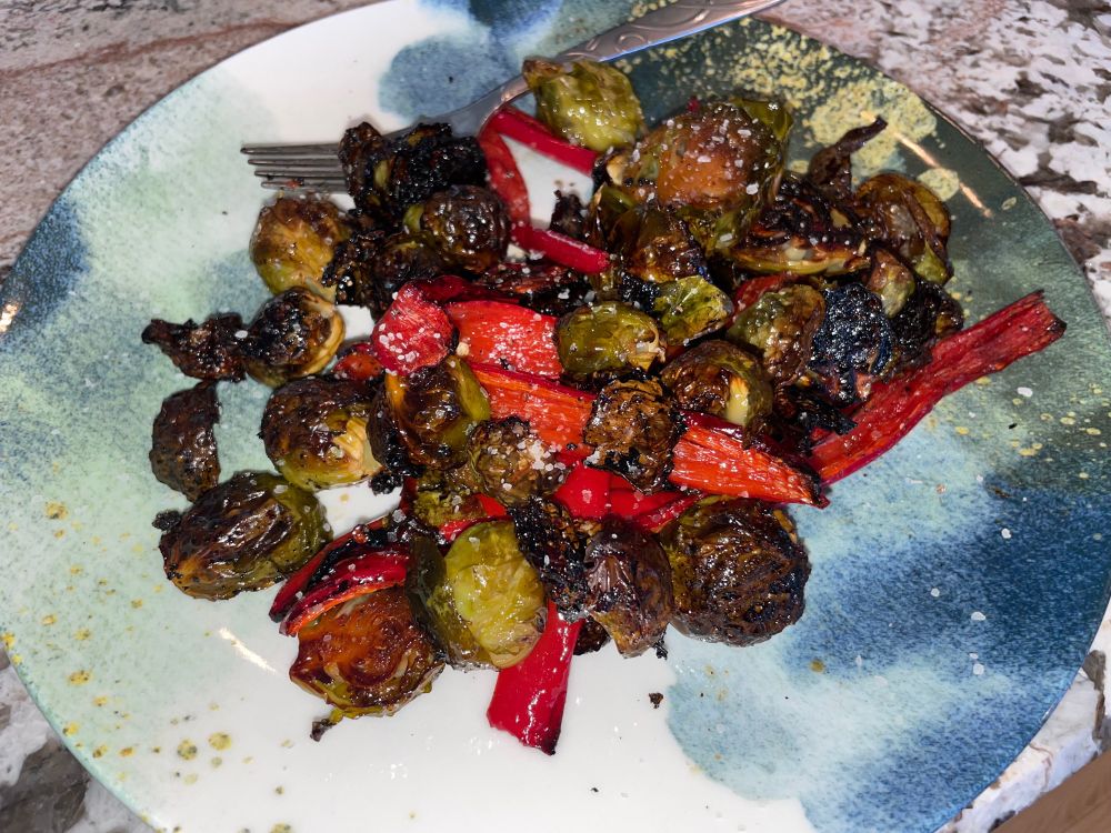 Roasted Brussels sprouts and Carmen Peppers:
Wash, trim, and slice (lengthwise) Brussels Sprouts, add to roasting pan.
Wash, remove top & seeds, and slice (lengthwise) Carmen Peppers, add to roasting pan.
Drizzle olive oil and hot honey over vegetables in roasting pan. 1/4 tsp salt & pepper. 
Mix everything well in the pan, place in 375F oven for 40-50 mins (until outer part of Brussels Sprouts are crispy)
Sprinkle truffle salt before serving.