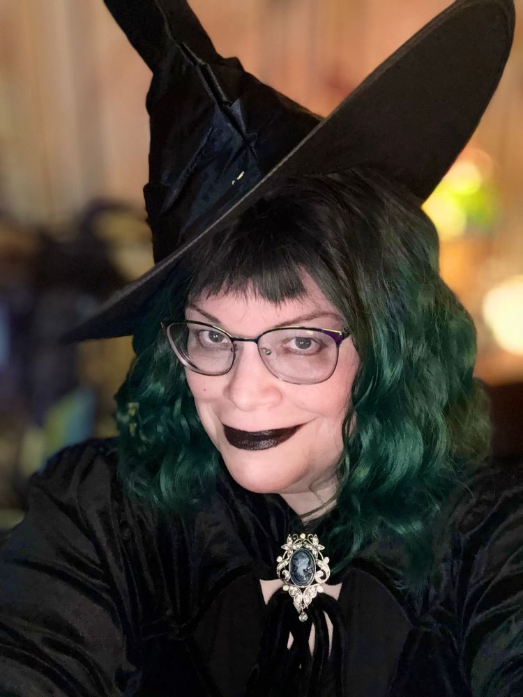 Headshot of Suze in the witch costume