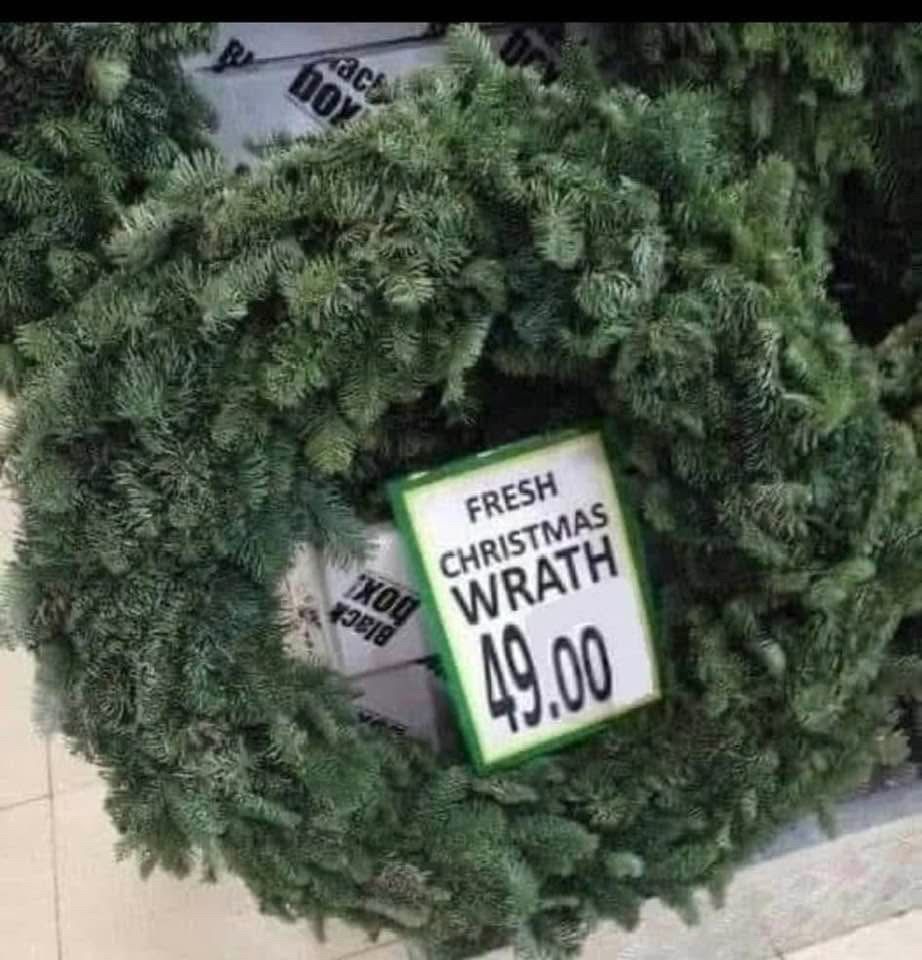 A picture of a green fresh pine Christmas wreath with a price tag of $49. Wreath is misspelled as wrath.