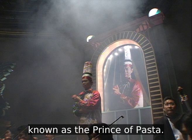 The Italian iron chef stands shrouded in smoke, proclaimed as the prince of pasta.