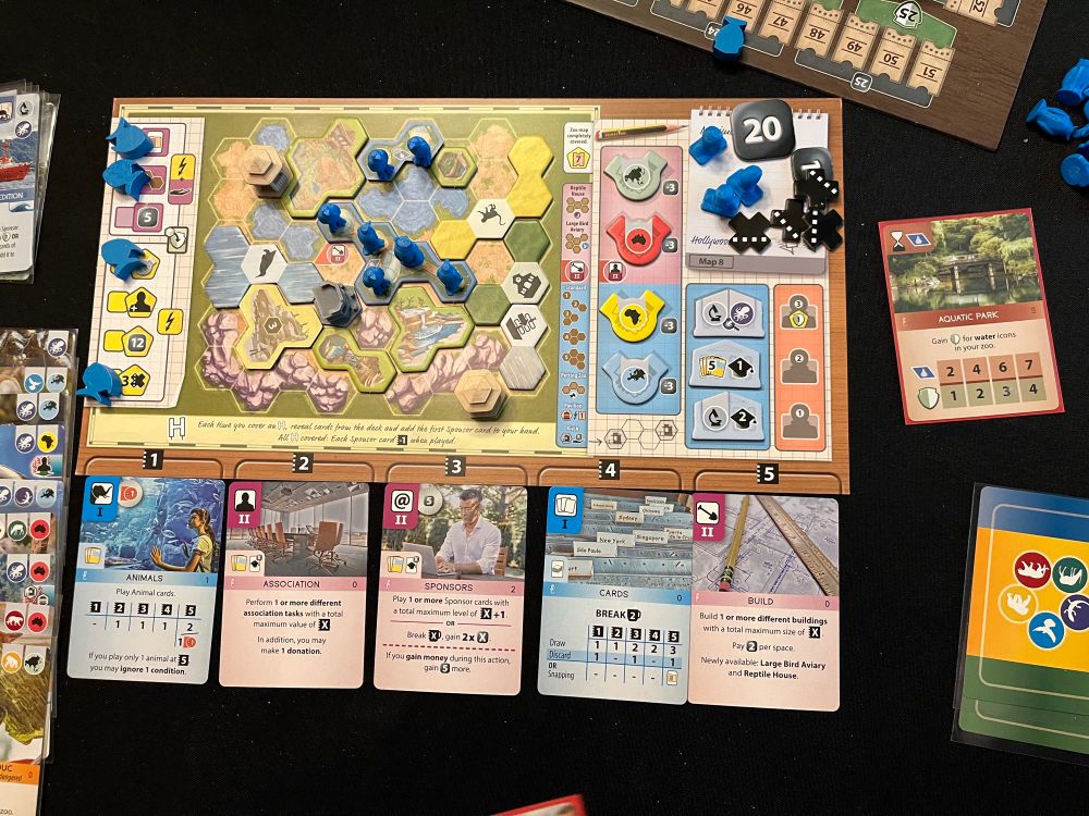 Ark Nova - Blue Player’s zoo map zoomed out, showing action cards and some zoo cards.