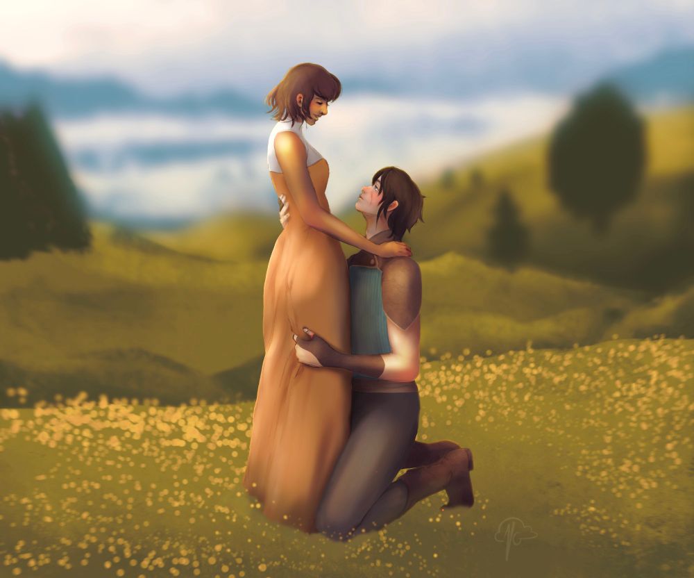 A young woman is standing, wearing a long orange dress, while a young man is kneeling with one knee on the ground, his arms wrapped around her. They are in a field of yellow flowers, with rolling hills and a large lake in the background 