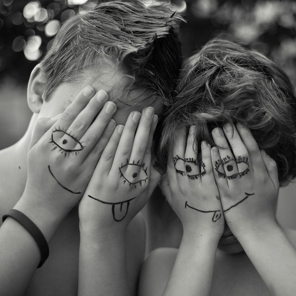 Kids with funny faces drawn on their hands
Image by Lora Moore-Kakaletris via Unsplash
