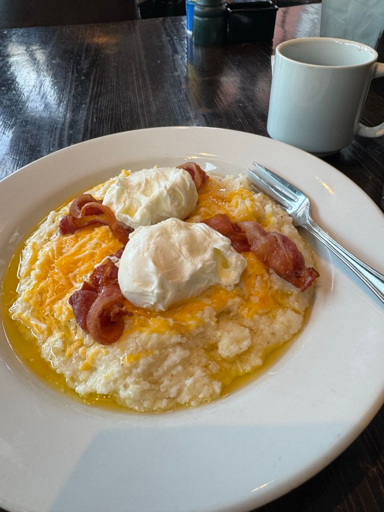 The New Orleans grits bowl: creamy grits, cheddar, bacon, poached eggs. Plus a good cup of coffee. 