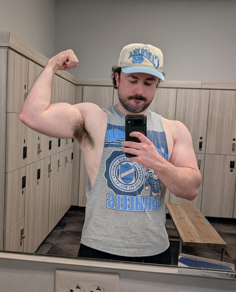 Tate flexing his bicep. It is, in my opinion, large looking