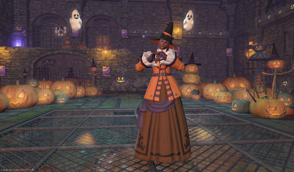 pink haired femroe in a witch hat and fancy dress making a heart with her hands