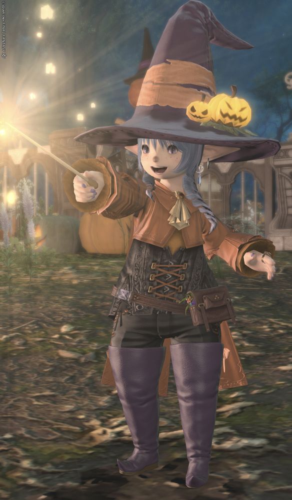 lalafell in a purple and orange witch-themed outfit casting a spell