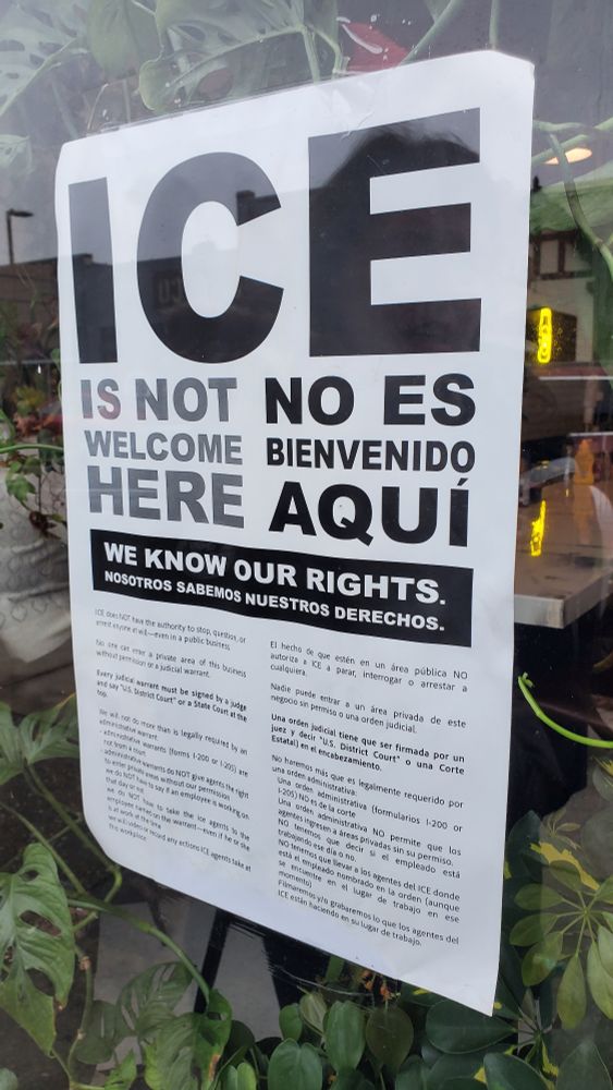 ice not welcome sign in a shop window