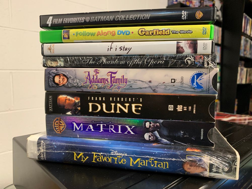 DVD:
Batman 1989-1997 Collection
Garfield The Movie Follow Along DVD
If I Stay
The Phantom of the Opera (1990) SEALED

VHS:
The Addams Family
Frank Nerbert’s Dune
The Matrix
My Favorite Martian ALSO SEALED
