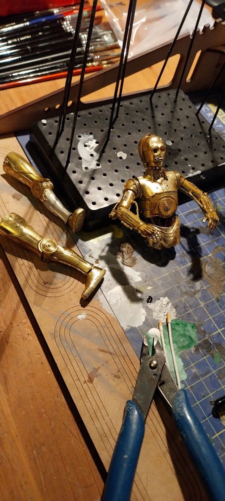 Bandai See Threepio kit in bits after weathering with an oil wash.