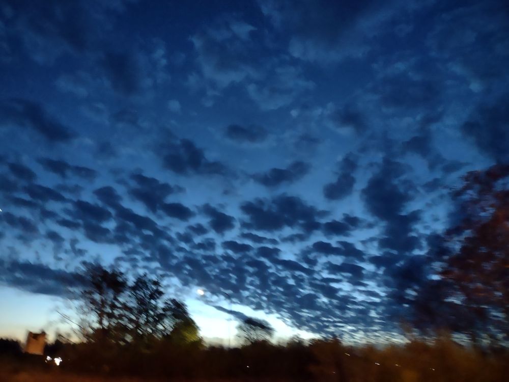 Cloudy dark blue skies with unusual rippling look.