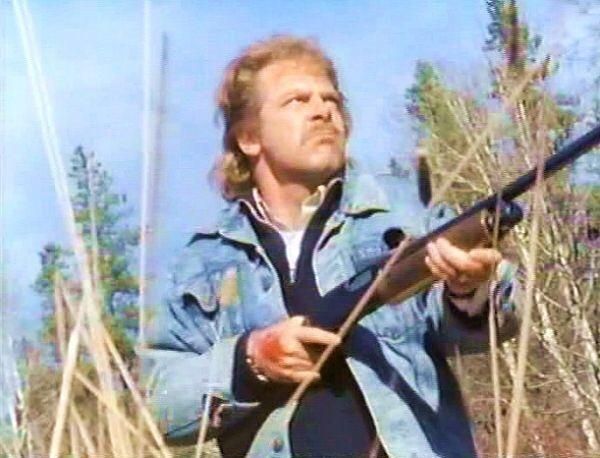 Zap Rowsdower, from the film The Final Sacrifice (of MST3k fame.) He's wielding a shotgun and a glorious head full of hockey hair.