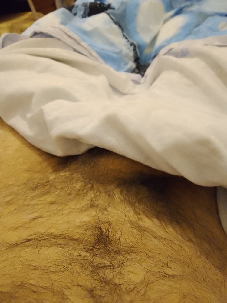 Me with my pants down, hiding my dick so that only my pubes is visible (there's still a bit of shaft though)