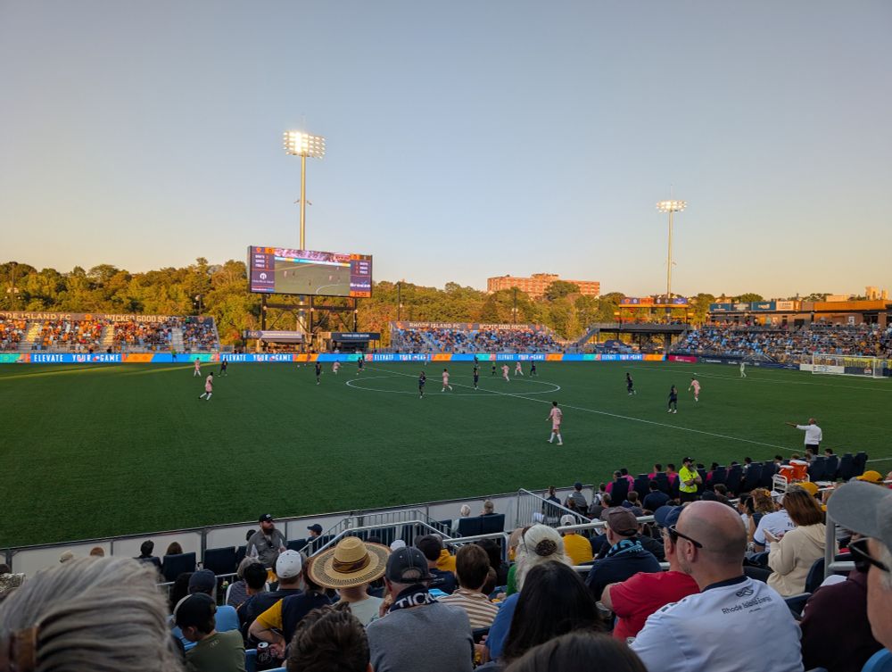 RIFC plays on the pitch against Las Vegas. This is before sunset and there is a large crowd watching 