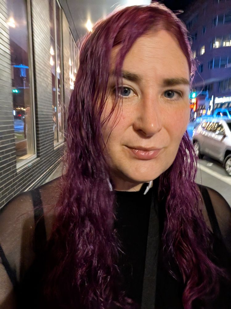 Marie walking in Boston, still with dark purple hair