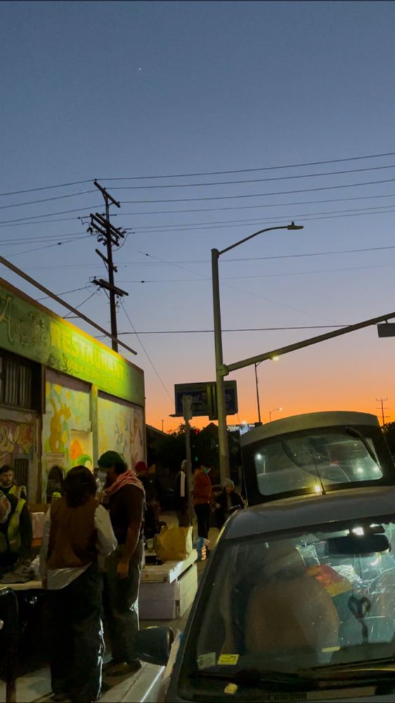 people loading a car with supplies