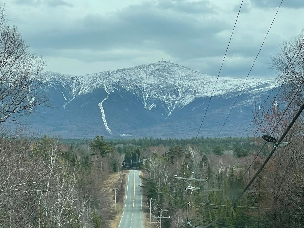 Snow covered Mt. Washington as seen from a roadside