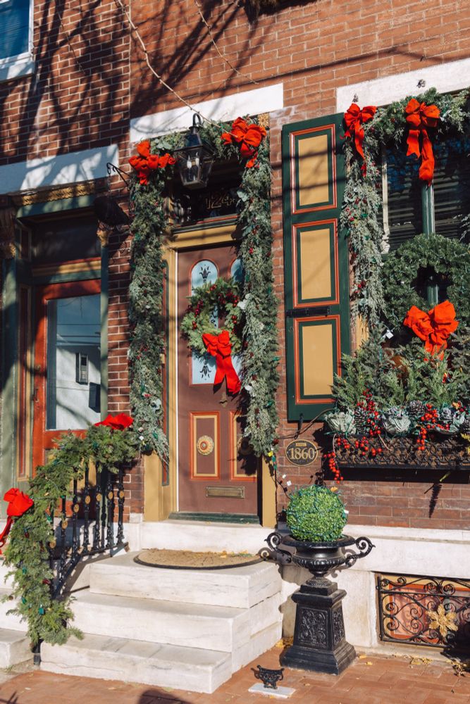 A house decorated for Christmas with garland and wreaths