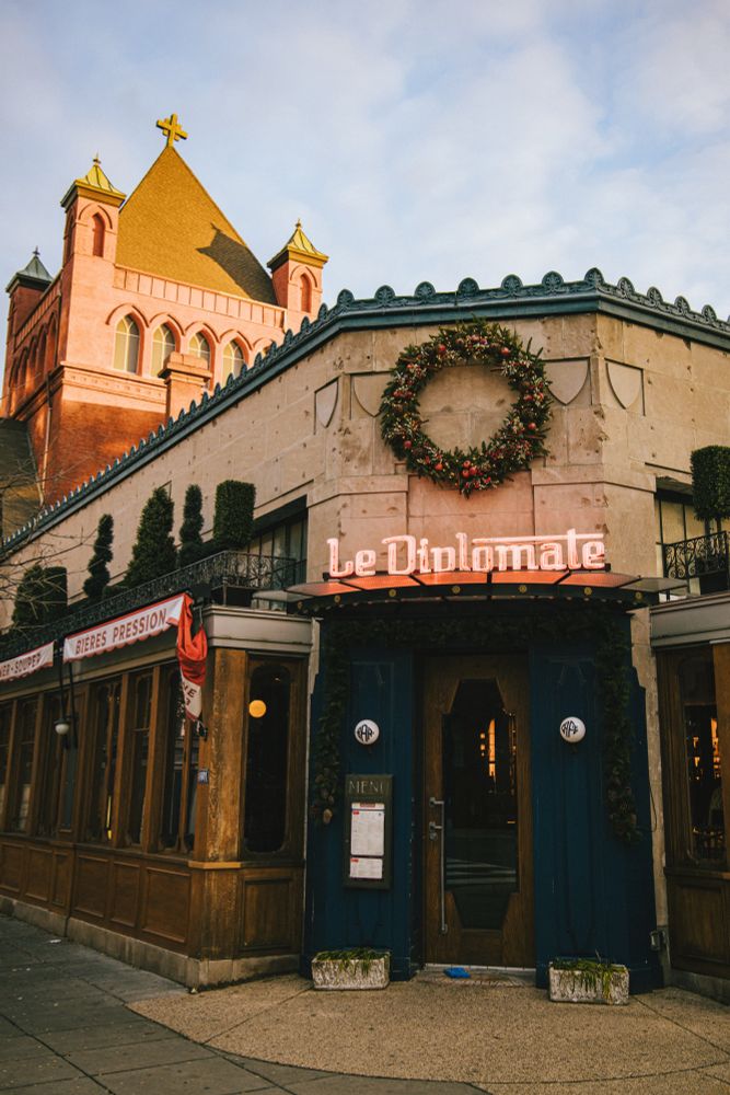 DC restaurant le diplomate with a Christmas wreath hung above the door