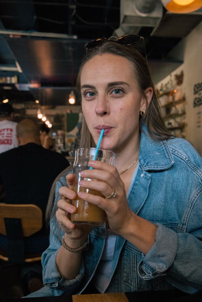 A picture of my wife drinking an iced latte