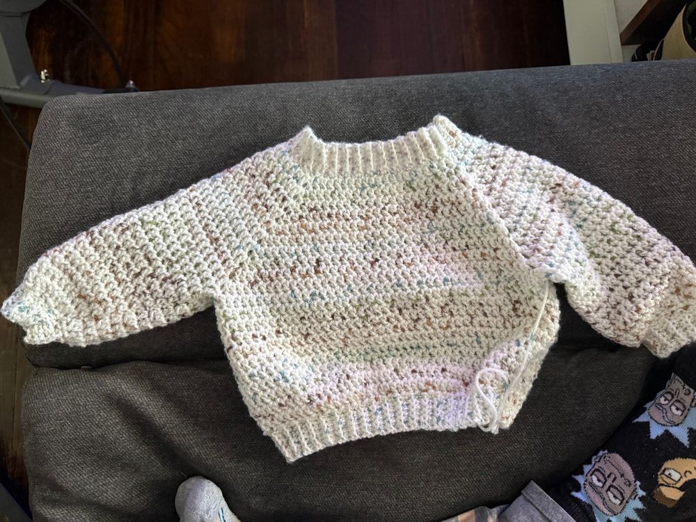 a crochet sweater for a baby