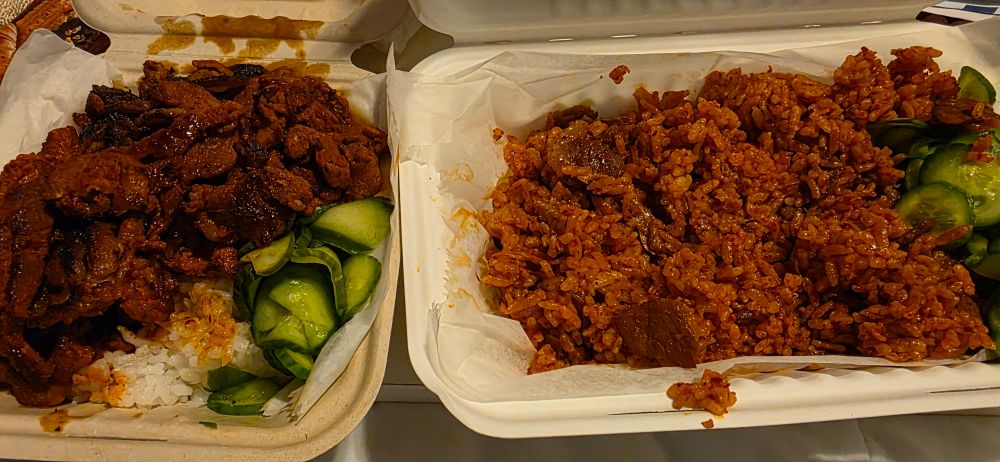 Spicy Pork bulgogi and kimchi fried rice with cucumbers on the side