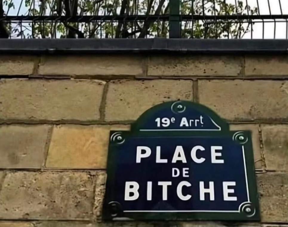 Black street sign/plaque on a wall in Paris, indicating the Place de Bitche in the 19th Arrondissement.