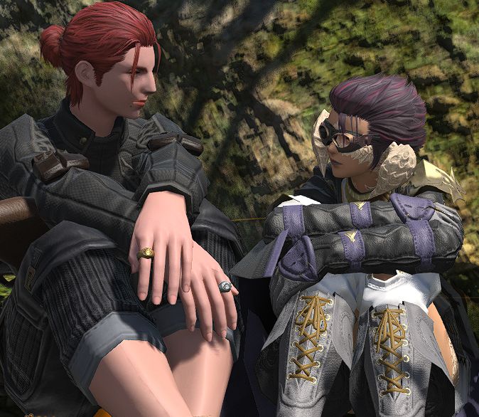 Valliant and Harumi sitting together in Gridania on the ground. Harumi is sitting with her arms wrapped around her knees, looking into the distance pensively. Valliant is looking at Harumi, smiling softly.