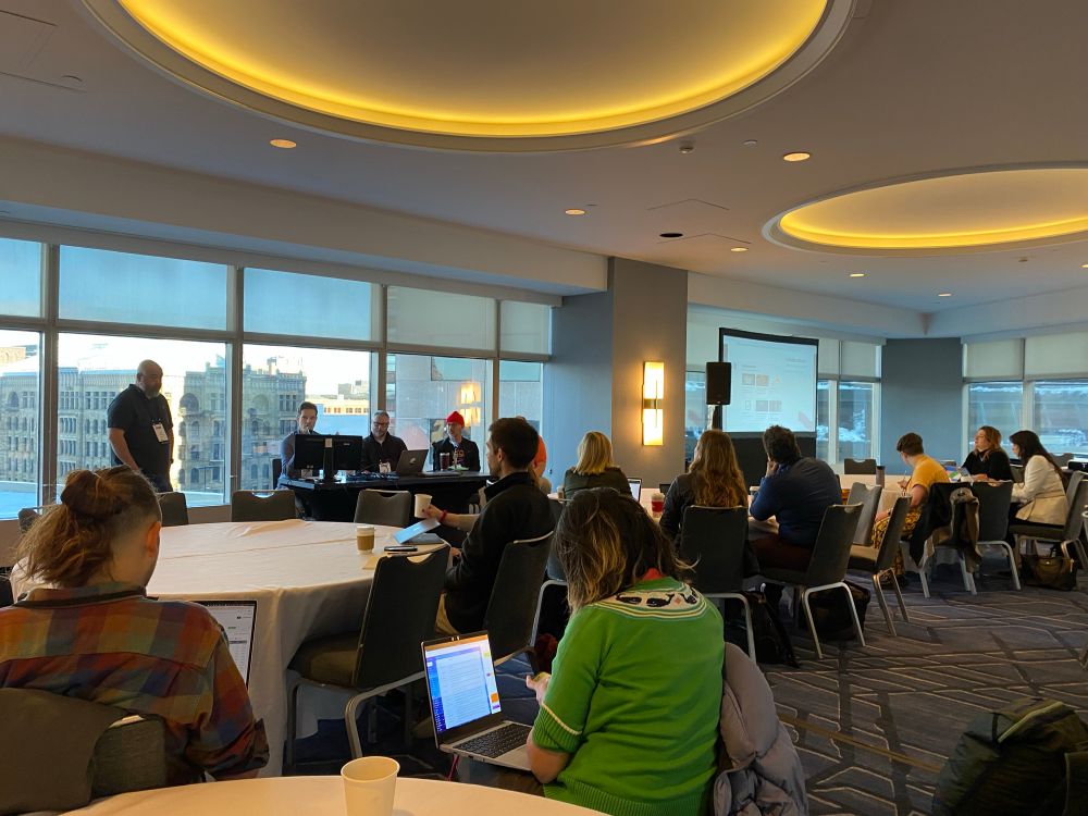 Picture of conference room filled with data nerds