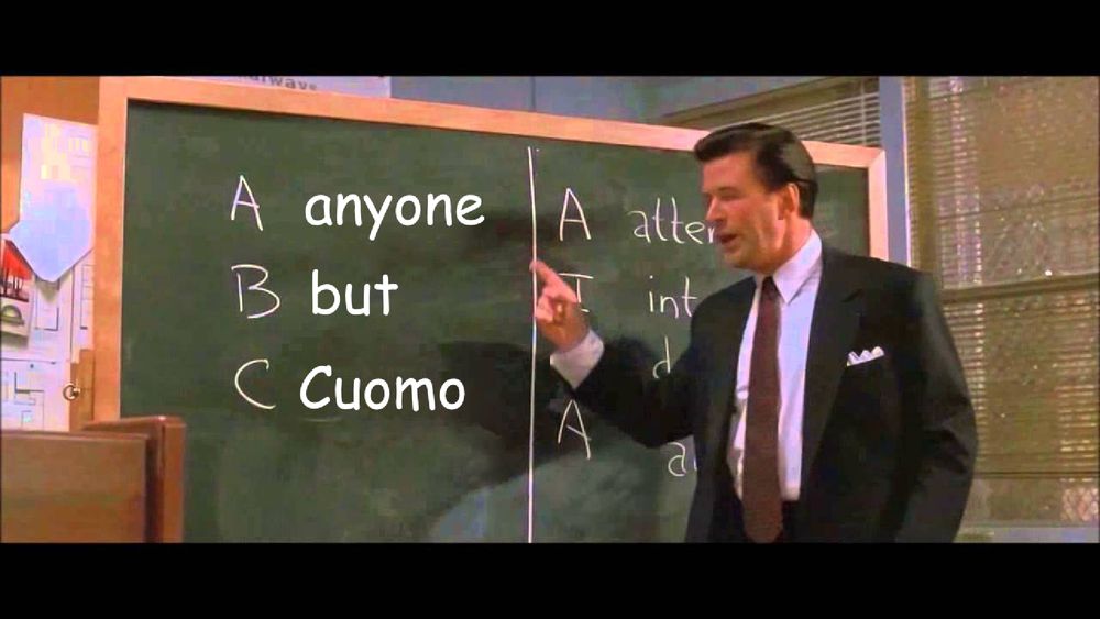 alec baldwin in the famous scene in glengarry glenn ross, where he has written on a chalkboard "ABC: Always Be Closing" but it's been changed with a sloppy photoshop to "Anyone But Cuomo"