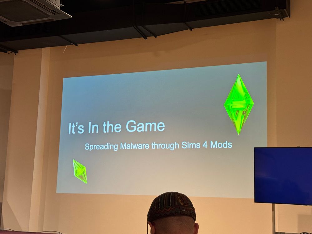 Picture of the first slide of the talk “it’s in the game - spreading malware through Sims 4 Mods”