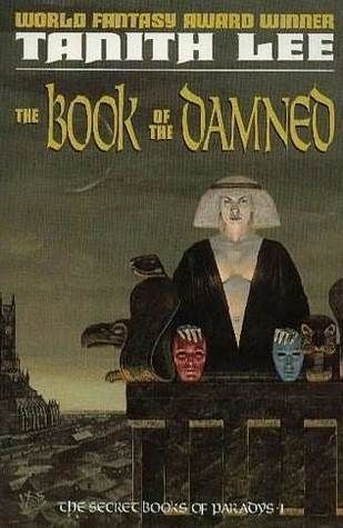 Cover art for The Book of the Damned by Tanith Lee. An androgynous ancient Egyptian noblewoman stands on a stone balcony, overlooking a city inspired by medieval Paris. She is flanked by gargoyles and her hands rest on two detached heads.