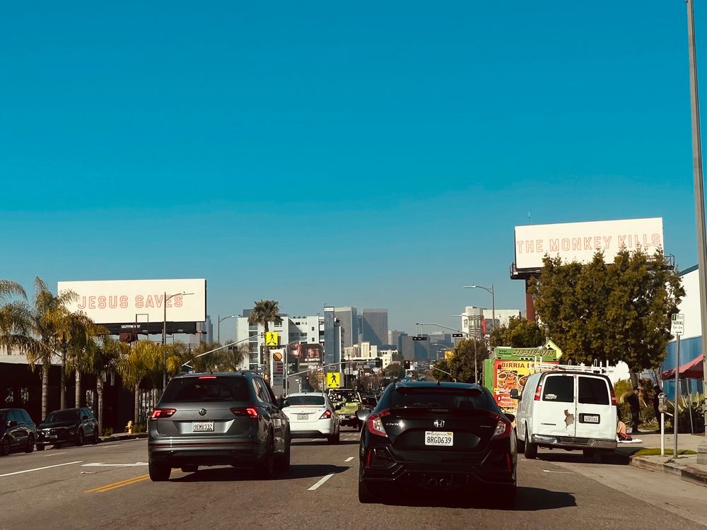 “Jesus saves / The Monkey kills” billboards in Los Angeles 