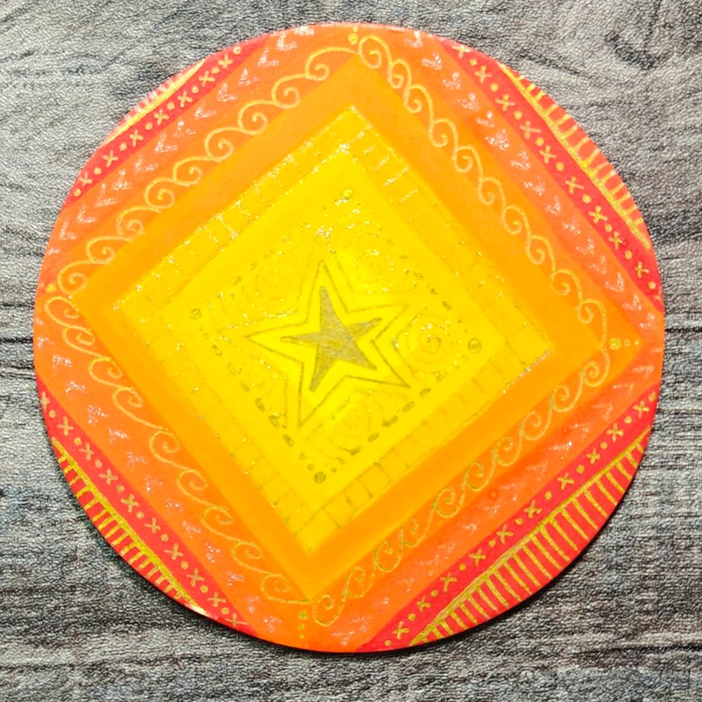 Orange Squared Circled - Mixed Media Circle Placemat of graduated red to orange to yellow concentric squares overlain with zentangle line marking patterns 

Materials used
Background: Water Diluted Brusho Pigment Watercolour Powder in Sunburst Yellow, Yellow, Orange, Gamboge, Scarlet and OST. Red

Zentangle line marking patterns: Arrtx Gold metallic Gel Pen.