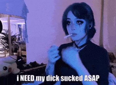 Woman smoking a cigarette captioned “i NEED my dick sucked ASAP”