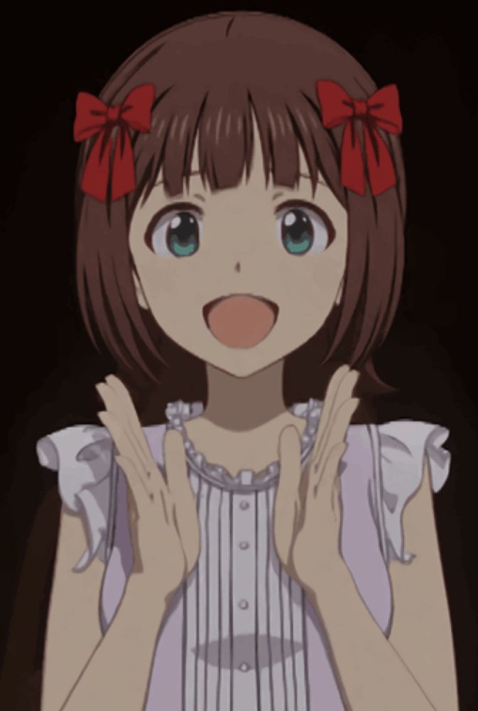 a girl with a red bow in her hair is clapping