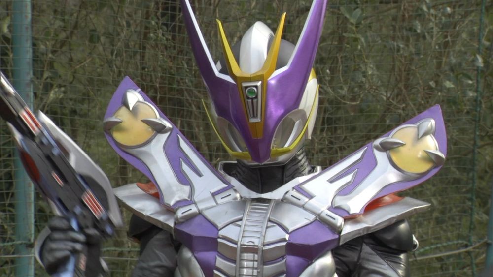 An image of Kamen Rider Den-O's Gun Form. It's mainly silver and purple, and the visor greatly resembles the alternate Soundwave's