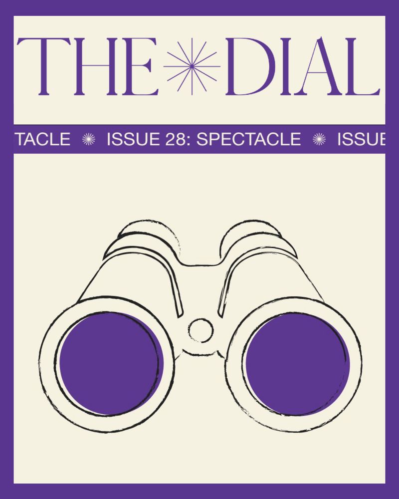 Graphic for Issue 28 of The Dial Magazine. Purple border with a cream background. The Dial logo is at the top in purple, with a purple banner with cream text that says "Issue 28: Spectacle" underneath. The issue's logo, a line drawing of a pair of binoculars with purple lenses, is large and centered.
