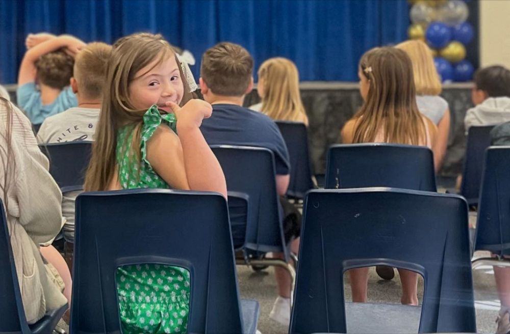 Our granddaughter, Juliette was born with Down syndrome. She lives life "on the scenic route," and surpasses our expectations every day. She's graduating second grade and earned recognition for reading excellence at the awards ceremony this morning.